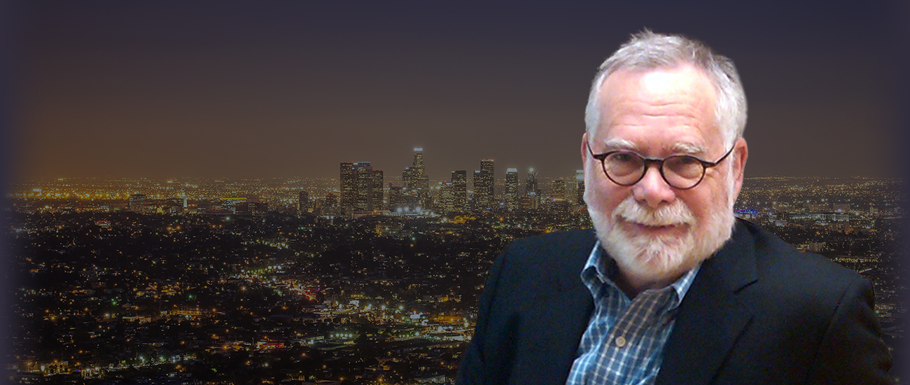 Attorney Errol H. Stambler in front of a nighttime city skyline